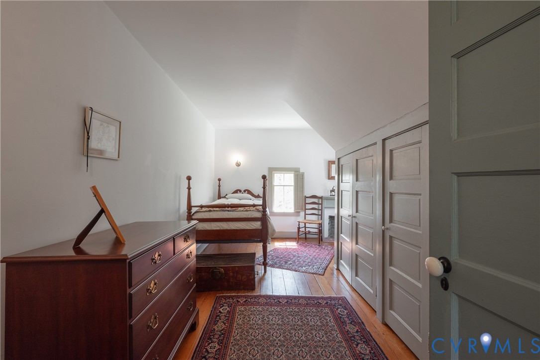 6353 Godwin Boulevard Suffolk, VA 23432 - Photo 26 of 50 Bedroom 3 is an L-shaped eaves room with a small f
