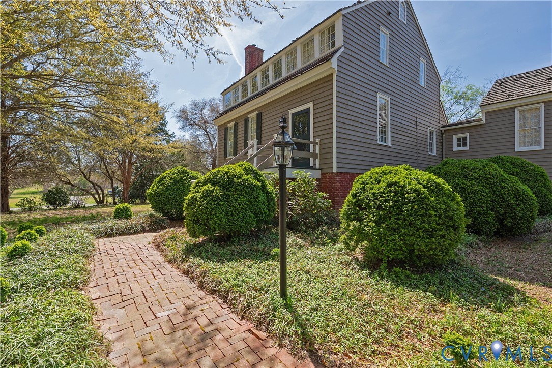 6353 Godwin Boulevard Suffolk, VA 23432 - Photo 3 of 50 A brick English boxwood-lined walkway leads to the