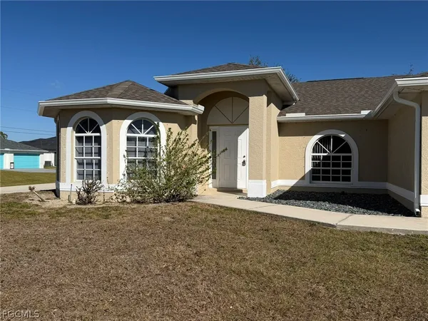 a front view of a house with garden