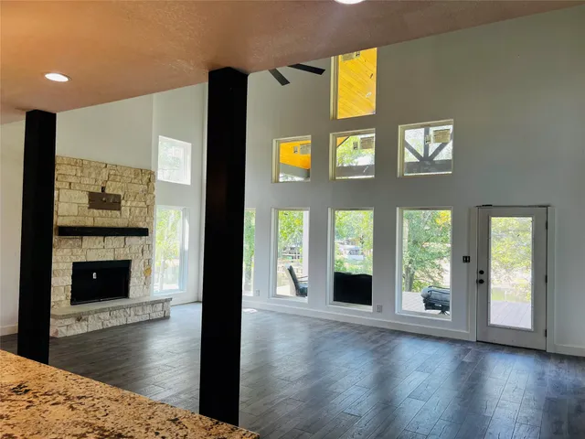 a living room with furniture and a fireplace