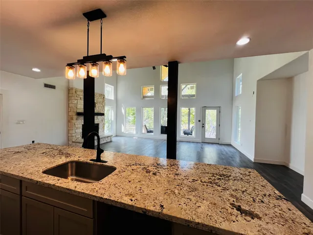 a kitchen with a sink and a table