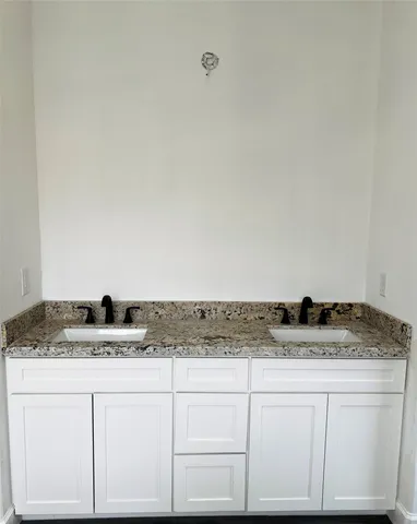 an empty room with wooden floor