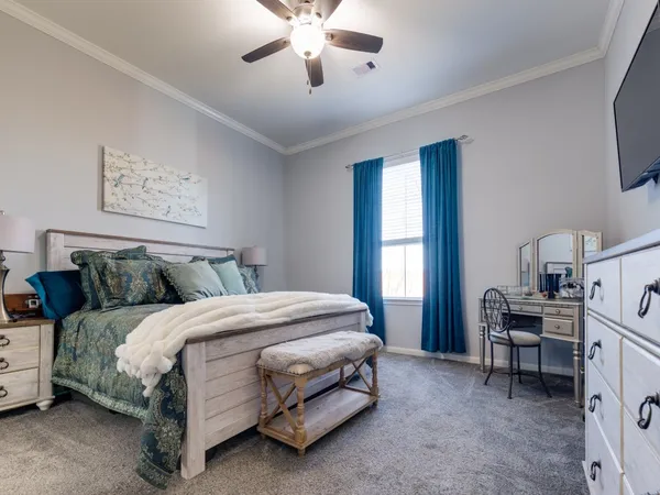 a view of walk in closet with clothes