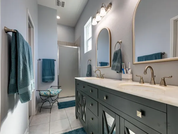 a living room with furniture and a book shelf
