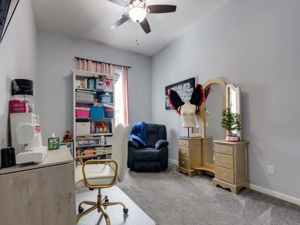 a bedroom with a large bed and a large window