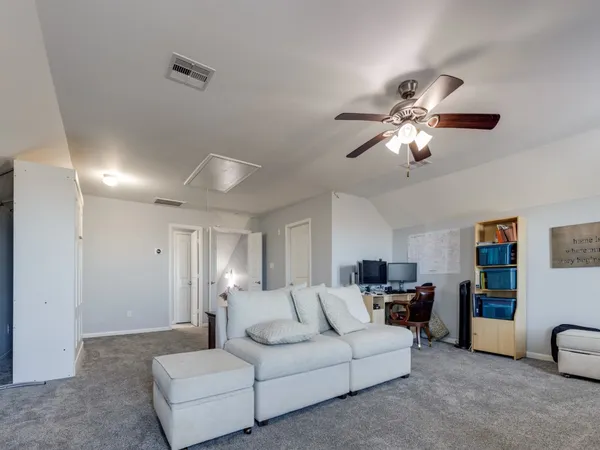a view of a patio with a table and chairs