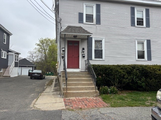 a front view of a house with stairs
