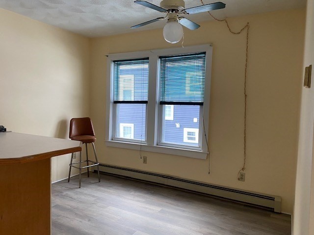 21 North Warren Street, Unit 2 Woburn, MA 01801 - Photo 4 of 12 a view of workspace with a window