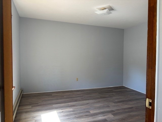 21 North Warren Street, Unit 2 Woburn, MA 01801 - Photo 9 of 12 a view of an empty room and wooden floor