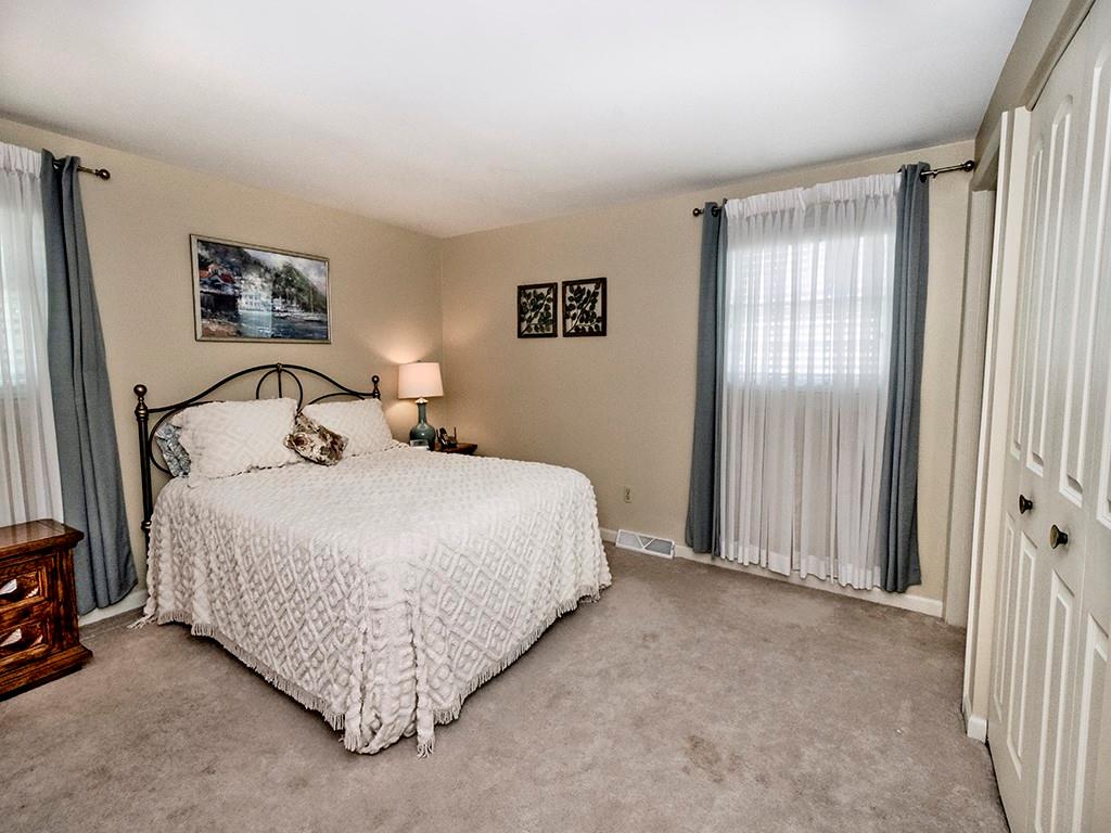 2501 Braddock Drive Lower Burrell, PA 15068 - Photo 13 of 22 a bedroom with a bed and a window