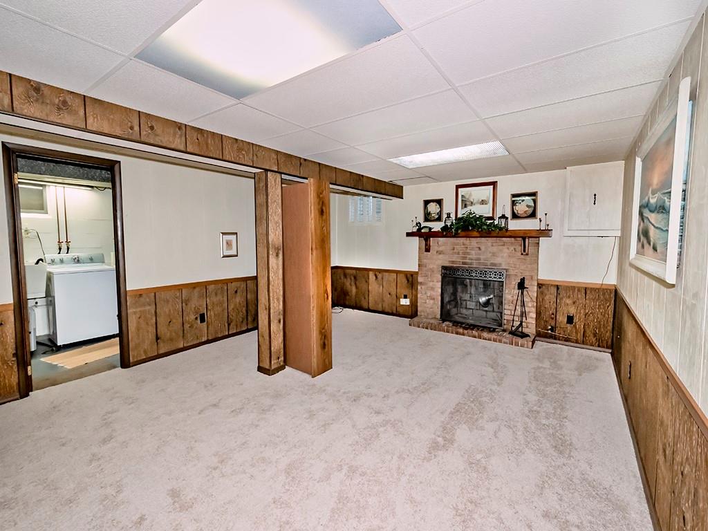 2501 Braddock Drive Lower Burrell, PA 15068 - Photo 17 of 22 an empty room with furniture and a fireplace