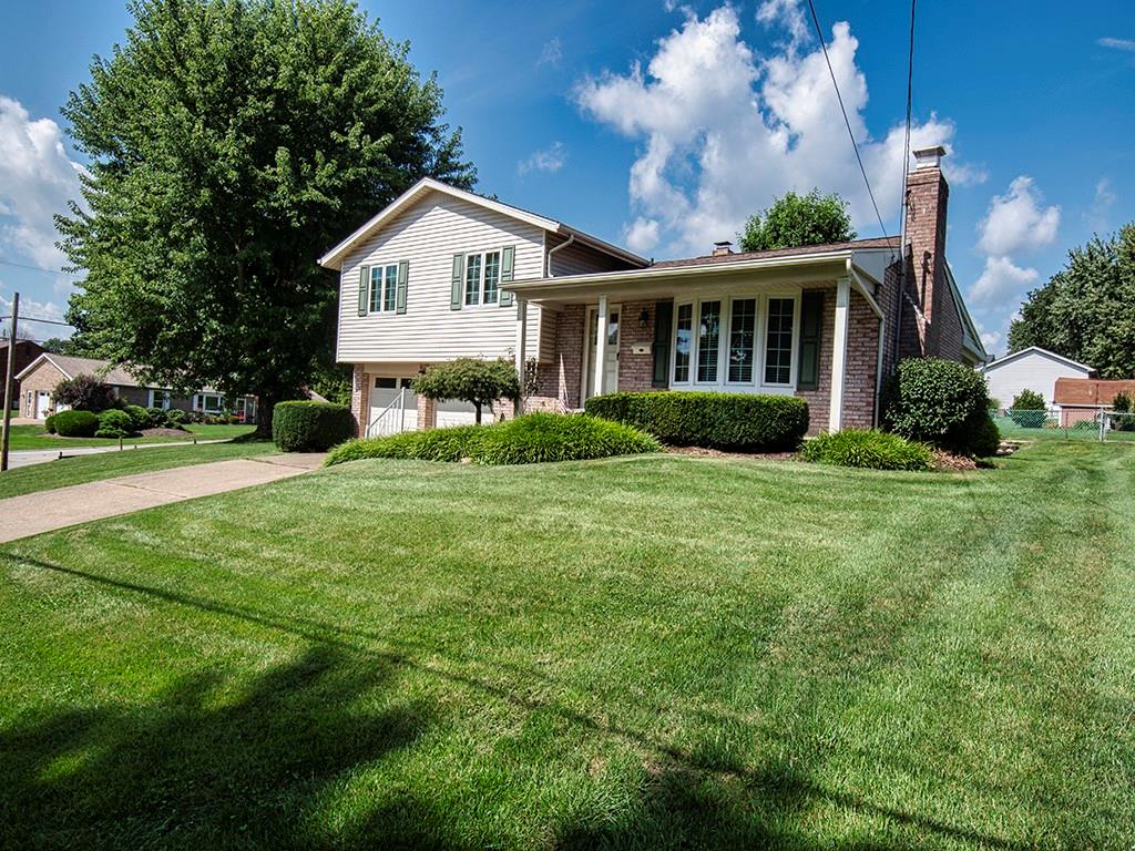 2501 Braddock Drive Lower Burrell, PA 15068 - Photo 18 of 22 a front view of a house with a yard and garage