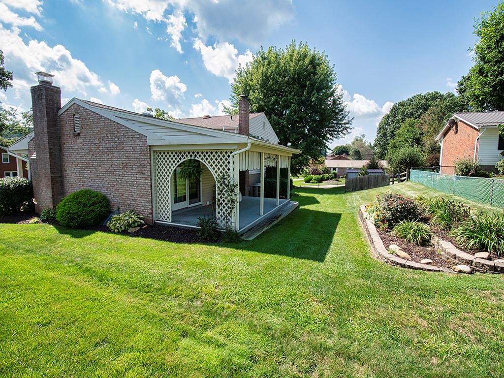 2501 Braddock Drive Lower Burrell, PA 15068 - Photo 19 of 22 a view of a house with a yard porch and a garden
