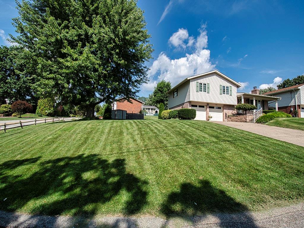 2501 Braddock Drive Lower Burrell, PA 15068 - Photo 20 of 22 a front view of a house with a big yard