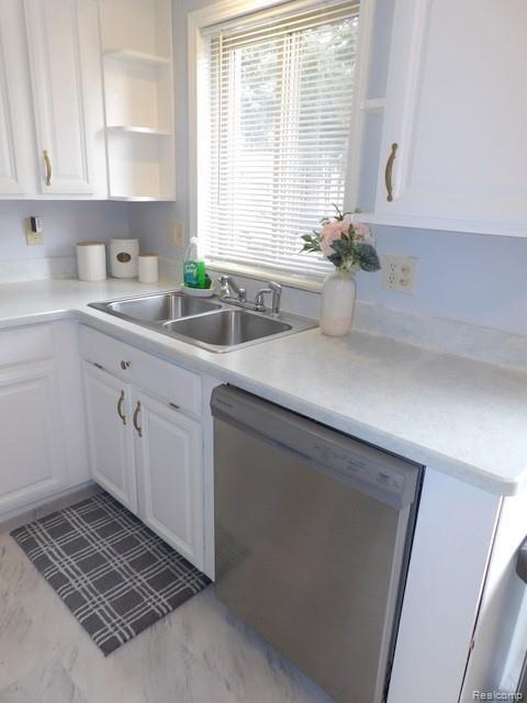 7911 Merrick Street Taylor, MI 48180 - Photo 20 of 42 20. NEW BUILT-IN DISHWASHER + DOUBLE STAINLESS-STEEL SINK WITH NEW (2020) DISPOSAL AND RECESSED LIGHT ABOVE!