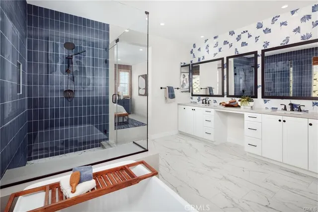 a kitchen with granite countertop a sink cabinets and stainless steel appliances