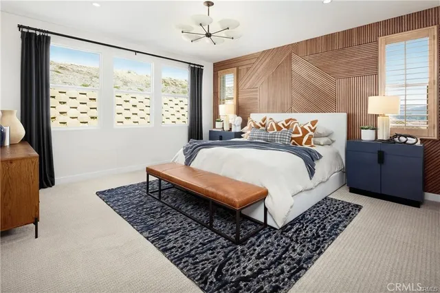 a bedroom with bed and a window