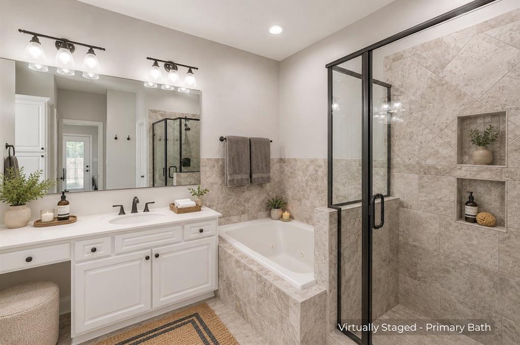 15 Trail Ridge Drive Melissa, TX 75454 - Photo 21 of 38 Double vanity with white cabinetry and integrated sink, featuring a long horizontal mirror and two three-bulb light fixtures