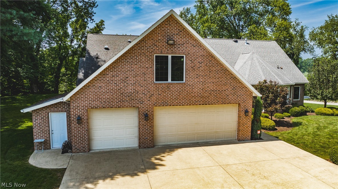 3908 River Road Vienna, WV 26105 - Photo 10 of 48 Spacious 3 car garage measures 28 1/2 ft deep by 33 1/2 ft wide. Bonus in-law suite is located above the garage