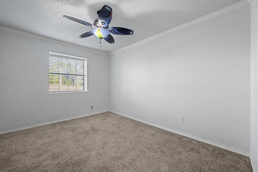 2312 Perkins Road Arlington, TX 76016 - Photo 19 of 29 Second Bedroom Carpeted room featuring a ceiling fan with light fixture, window with horizontal blinds, and white painted walls