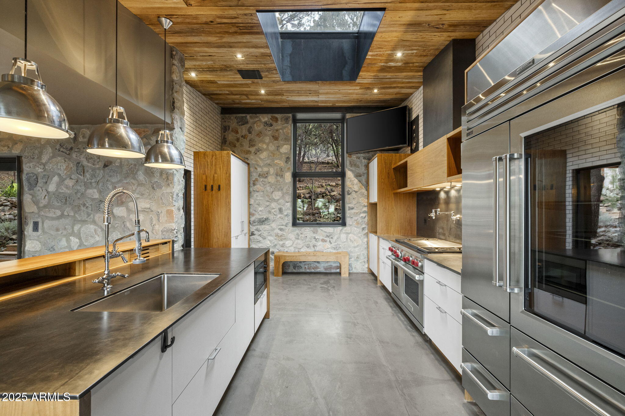51 Rill Road Prescott, AZ 86305 - Photo 27 of 89 a large kitchen with stainless steel appliances wooden cabinets and a granite counter tops with a large window