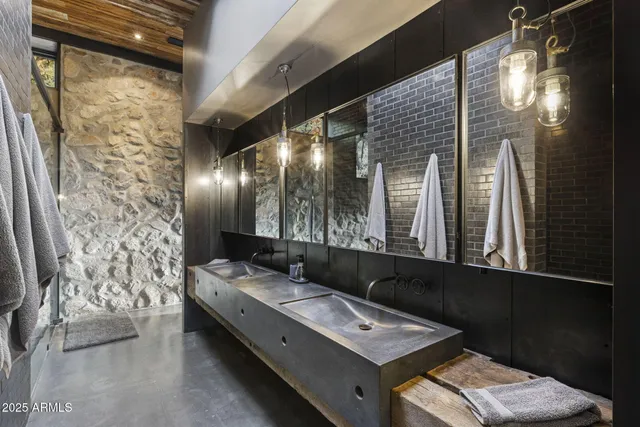 a view of a hallway with wooden floor and entryway