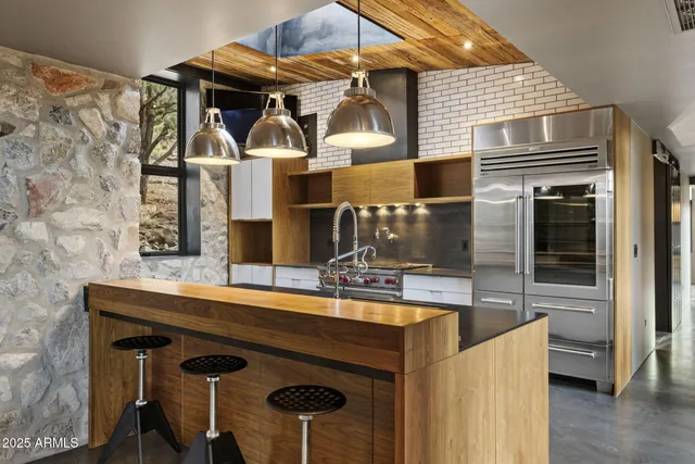 a living room with furniture a large window