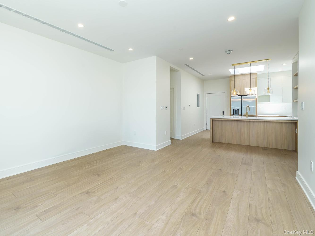 24 Lumber Road, Unit 2 Roslyn, NY 11576 - Photo 8 of 25 a view of an empty room with a fireplace