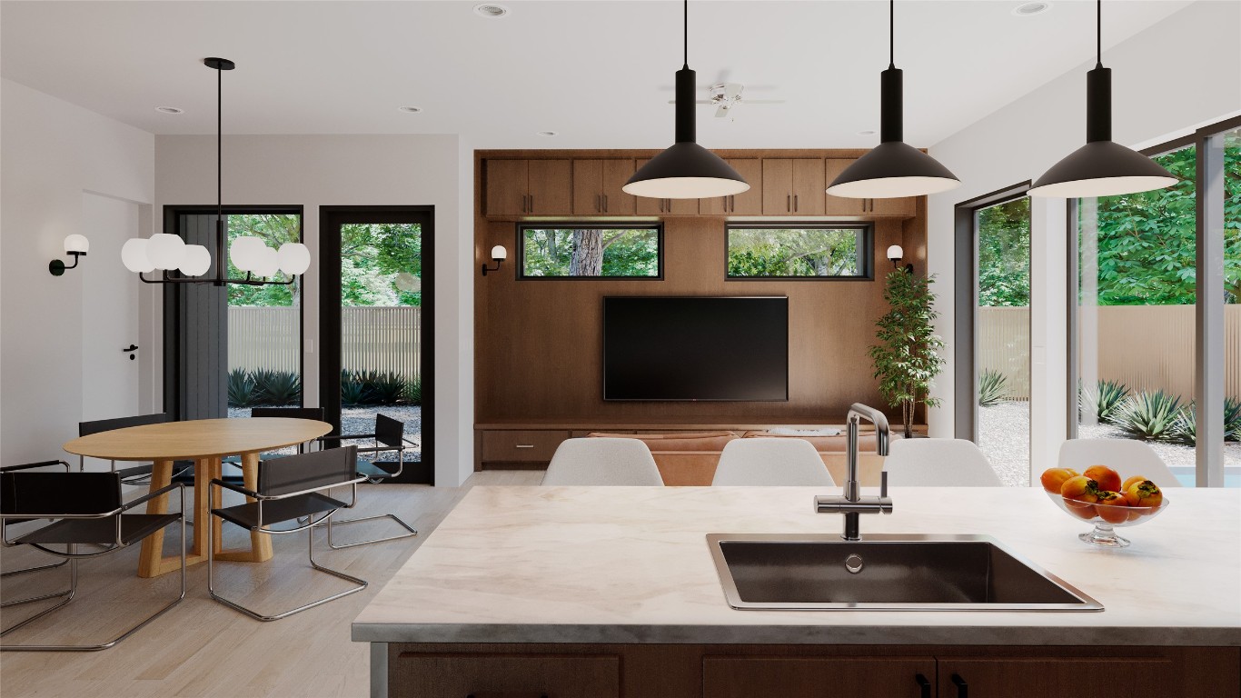205 Medina Street, Unit 1 Austin, TX 78702 - Photo 3 of 15 Kitchen with hanging light fixtures, recessed lighting, light wood finished floors, and a chandelier