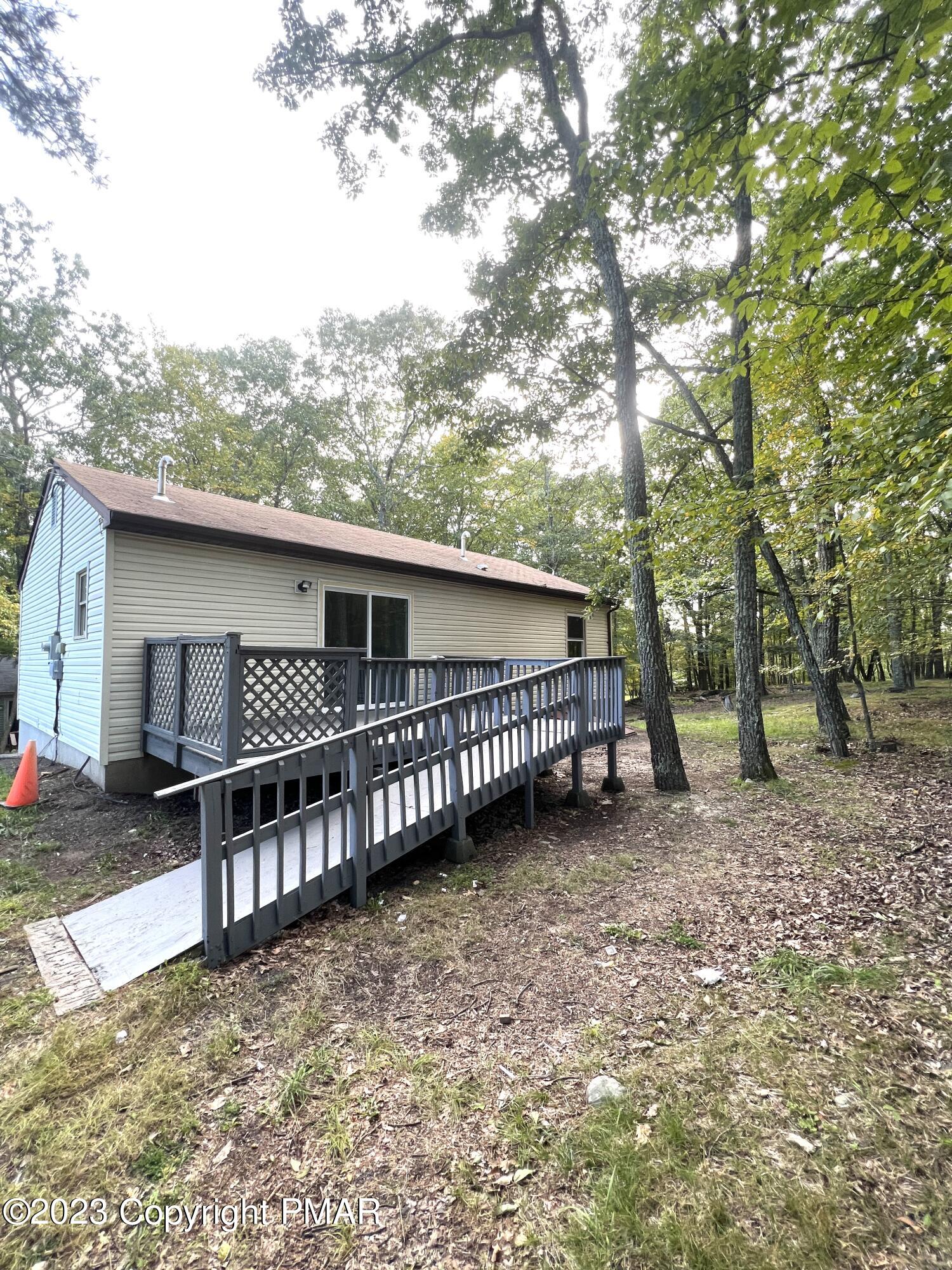 179 Gold Finch Road Bushkill, PA 18324 - Photo 15 of 15 a view of a house with a balcony