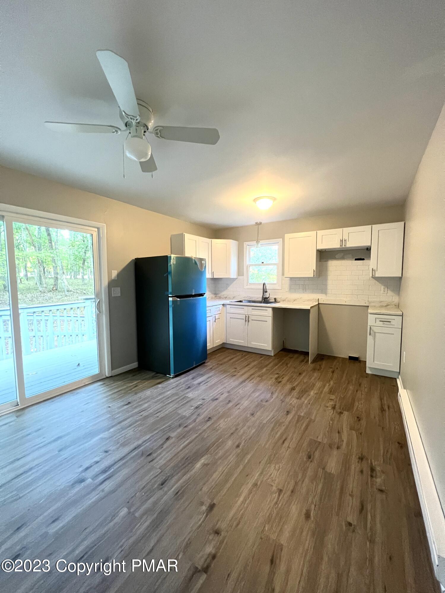 179 Gold Finch Road Bushkill, PA 18324 - Photo 2 of 15 a view of a kitchen with furniture and wooden floor