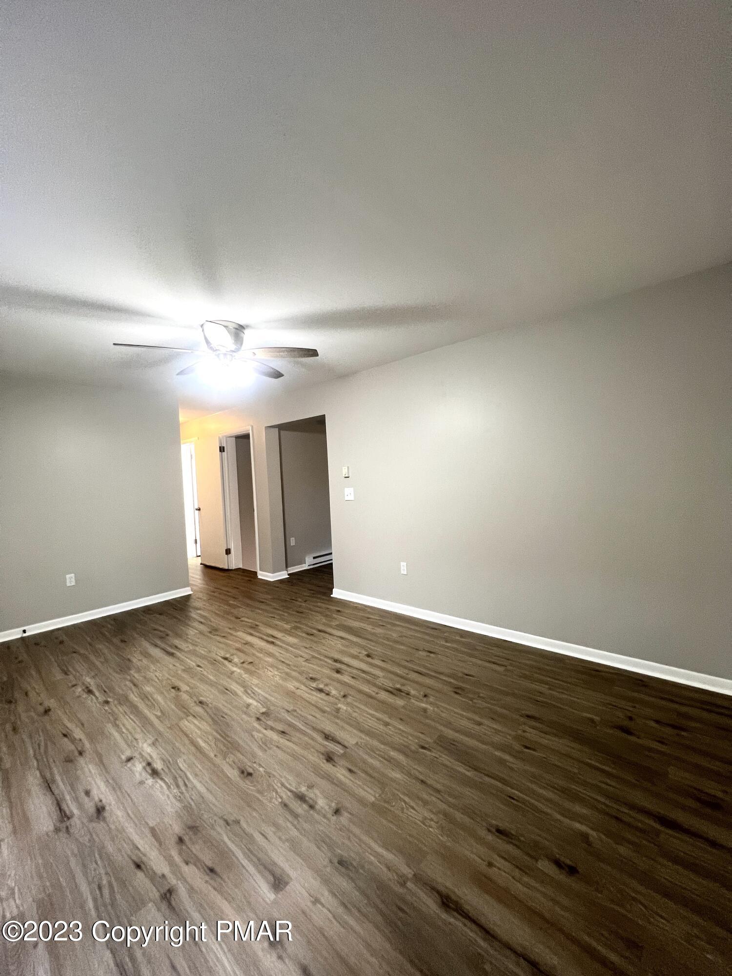 179 Gold Finch Road Bushkill, PA 18324 - Photo 5 of 15 a view of an empty room and wooden floor