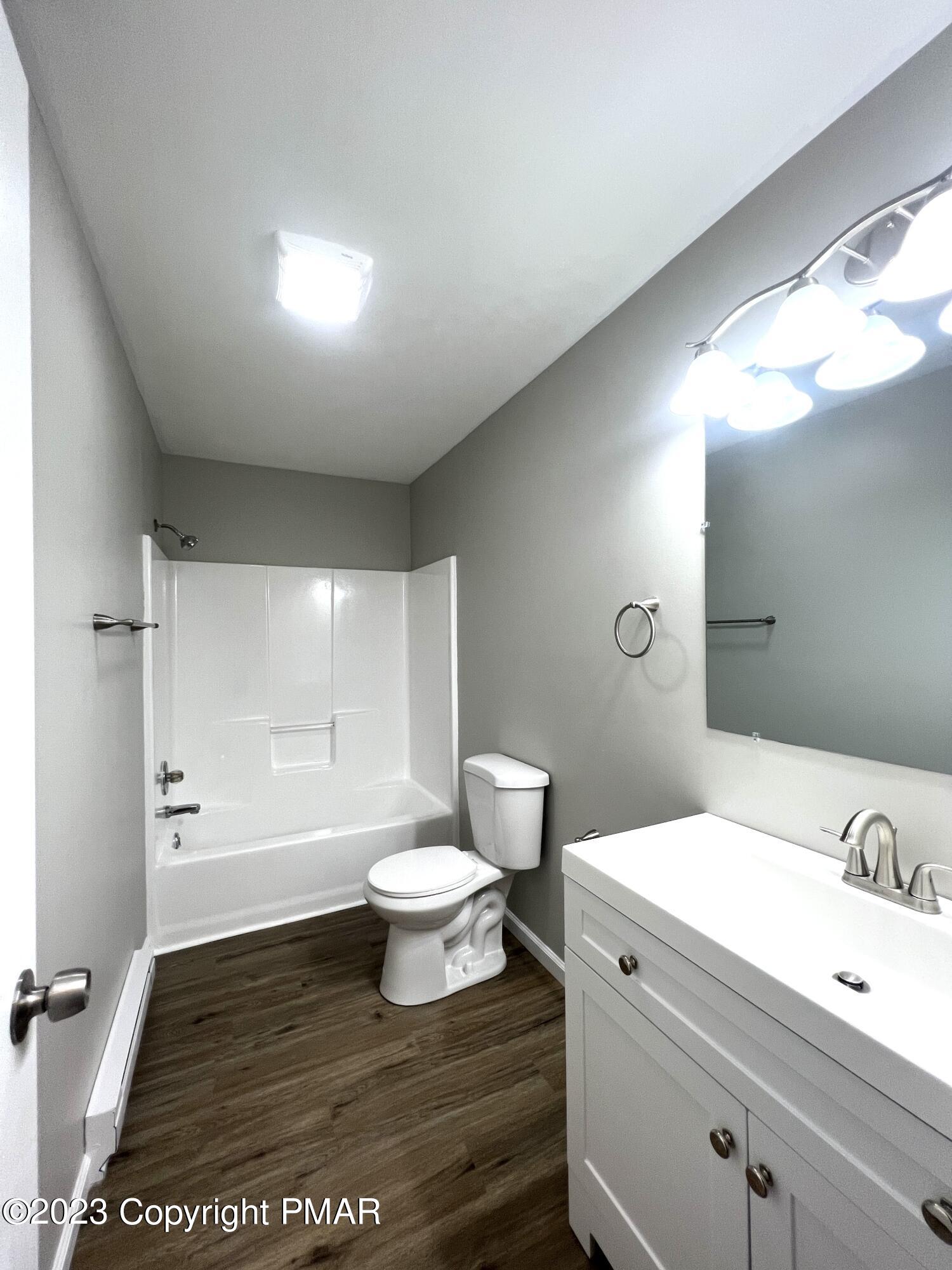 179 Gold Finch Road Bushkill, PA 18324 - Photo 6 of 15 a bathroom with a sink a toilet and shower