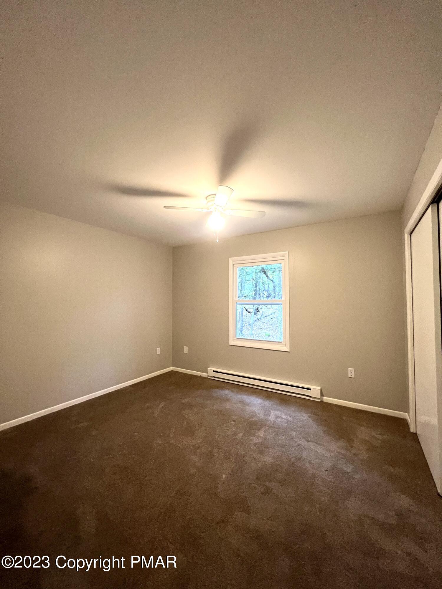 179 Gold Finch Road Bushkill, PA 18324 - Photo 9 of 15 an empty room with windows