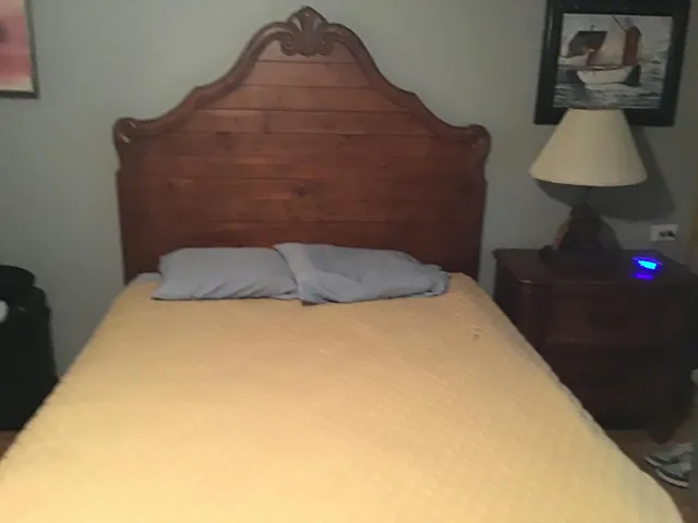 a living room with furniture and a mirror