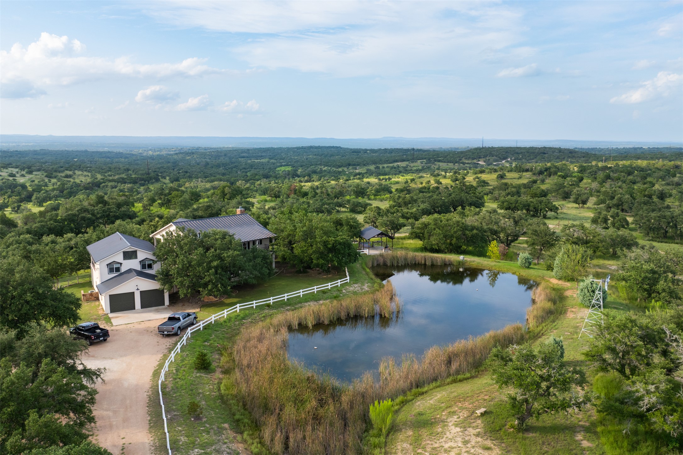 3149 Byrd Ranch Road Johnson City, TX 78636 - Photo 18 of 39 Drone / aerial view of a forest and a large body of water