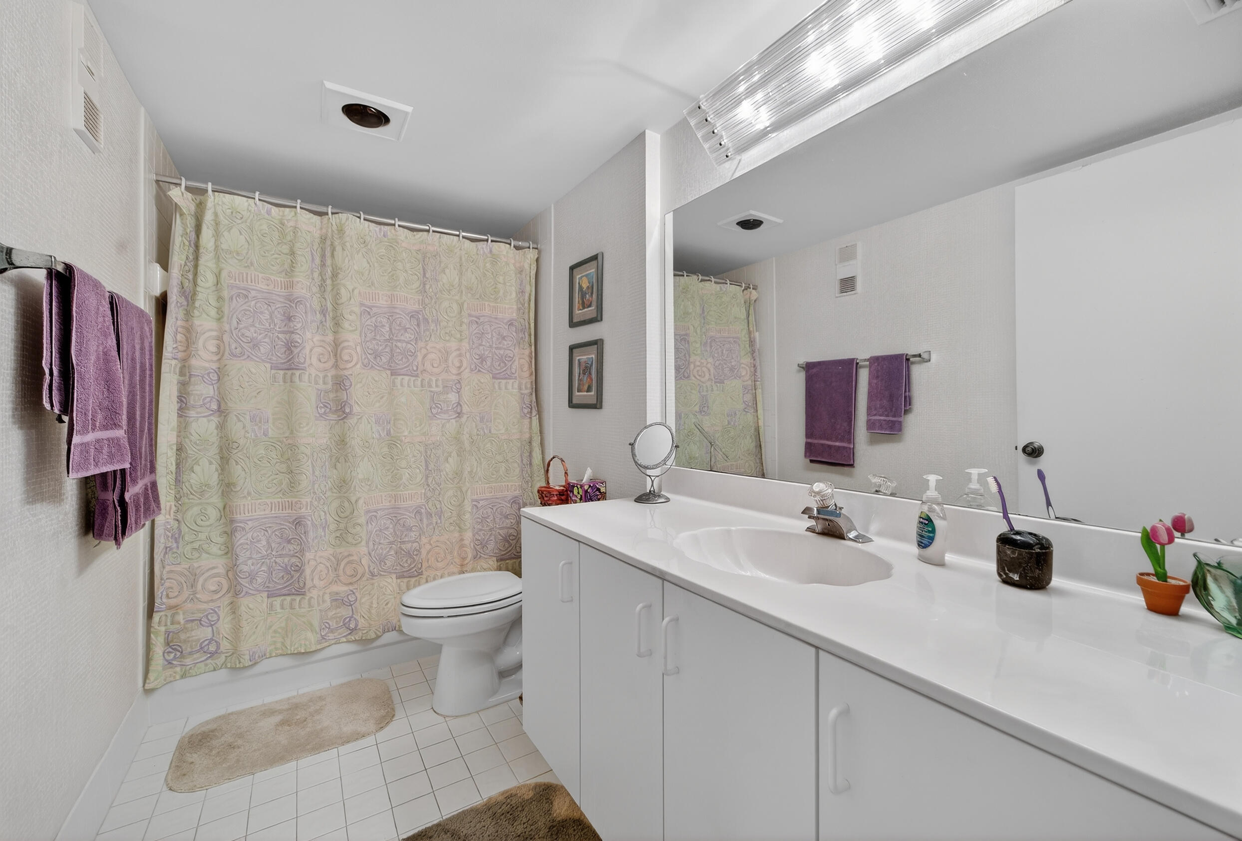 14112 Huntington Pointe Drive, Unit 309 Delray Beach, FL 33484 - Photo 20 of 50 a bathroom with a sink a toilet and shower