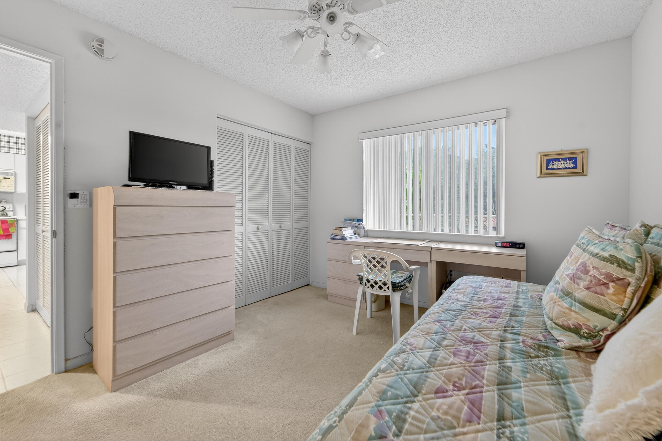 14112 Huntington Pointe Drive, Unit 309 Delray Beach, FL 33484 - Photo 22 of 50 a bedroom with furniture and a bed