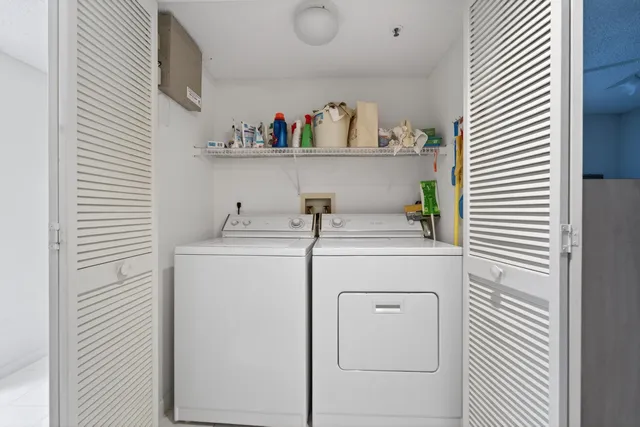 a utility room with dryer and washer
