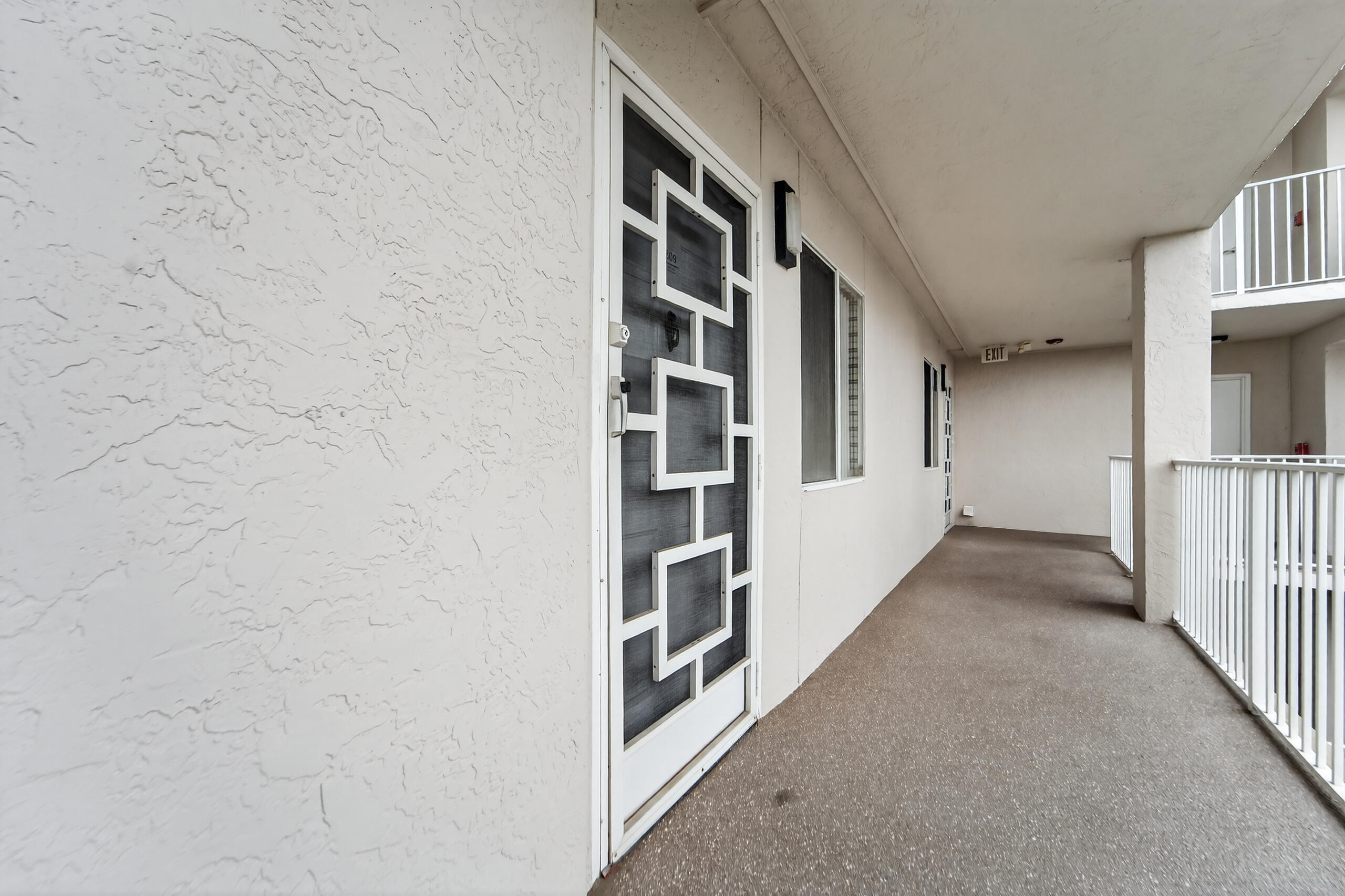 14112 Huntington Pointe Drive, Unit 309 Delray Beach, FL 33484 - Photo 25 of 50 a view of a hallway with seating space