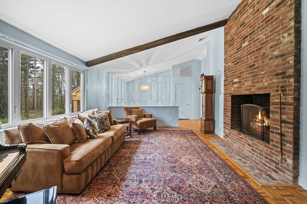 46 Georgetown Road Boxford, MA 01921 - Photo 11 of 40 a living room with furniture and a fireplace
