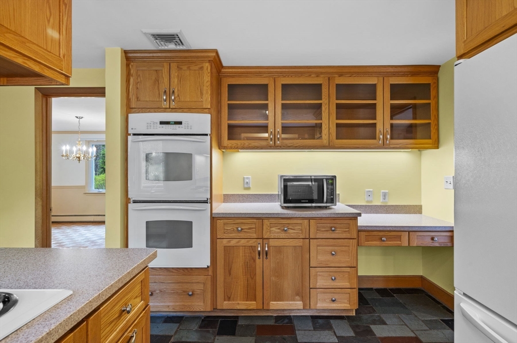 46 Georgetown Road Boxford, MA 01921 - Photo 14 of 40 a kitchen with a stove and a microwave