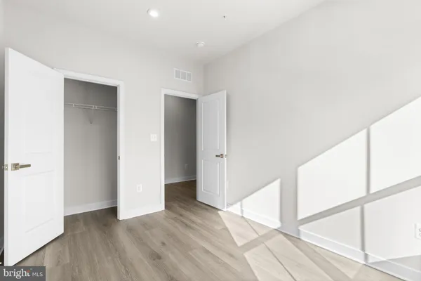 a view of entryway with wooden floor