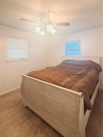 a living room with a bed and a table