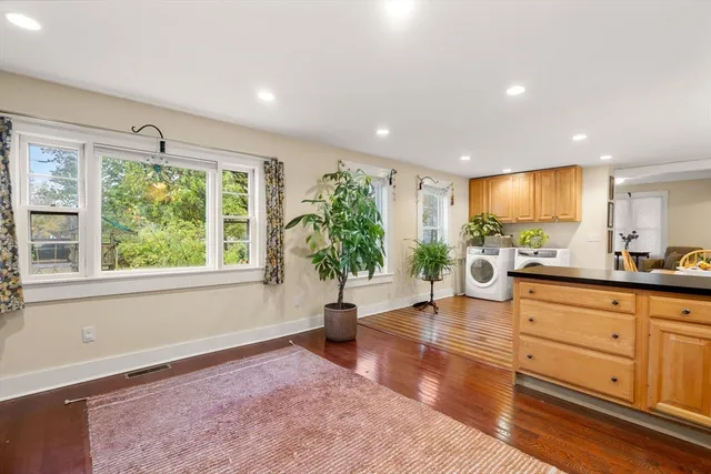 a bedroom with furniture and a potted plant