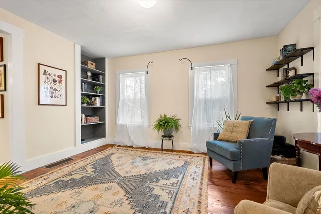 a bedroom with furniture and a potted plant