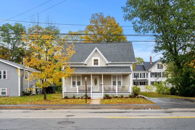 a front view of house with a garden