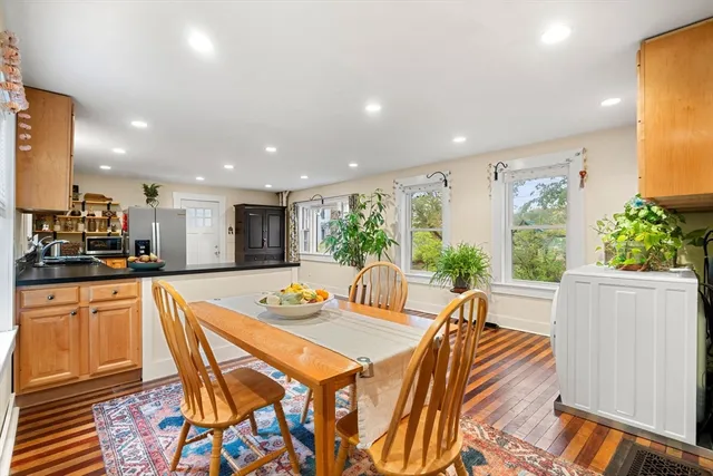 a dining room with a table and chairs