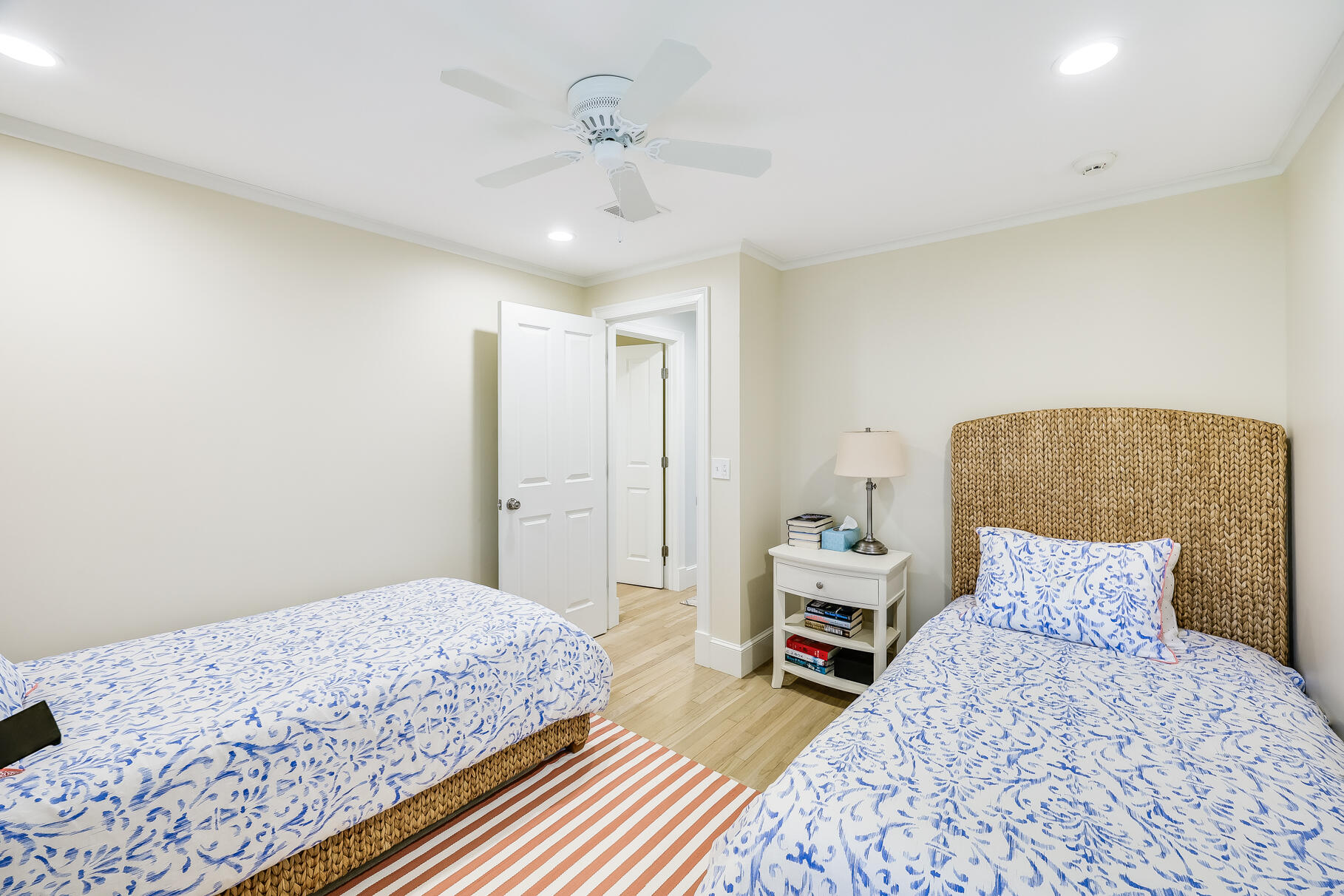 28 Bayview Road Osterville, MA 02655 - Photo 28 of 42 a bedroom with a bed and a chandelier