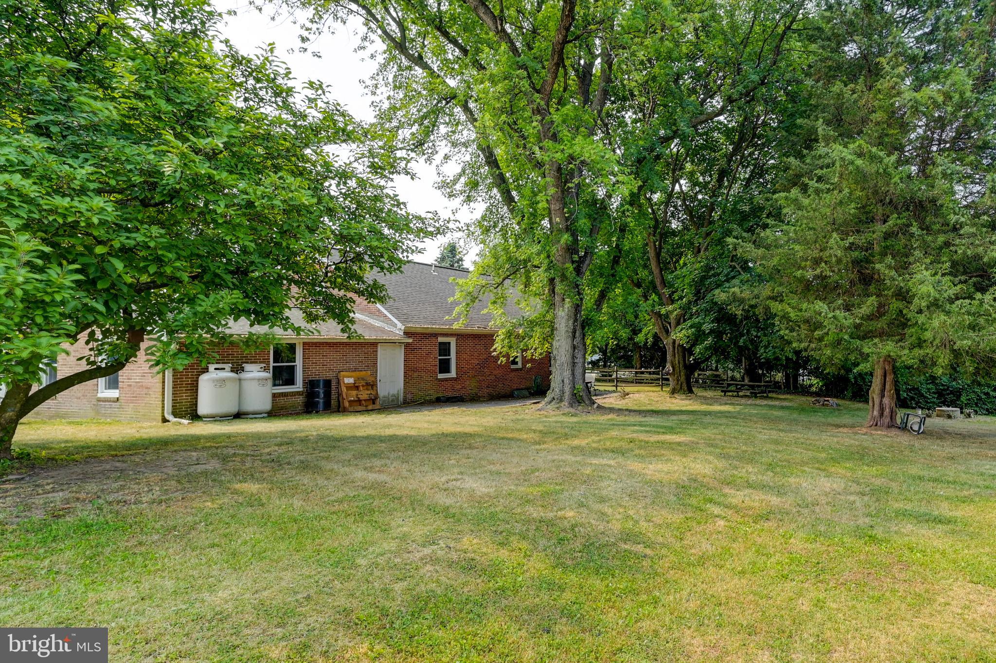 5371 Long Corner Road White Hall, MD 21161 - Photo 24 of 30 Serene backyard oasis with lush greenery.